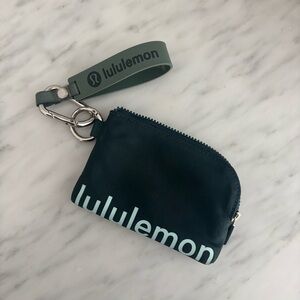 Green lululemon keychain and card wallet